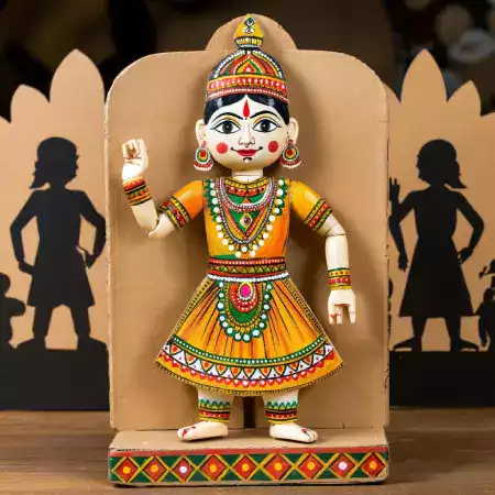 Custom designed marionette character created through consultation process with theater company including design sketches approval phases and specific costume requirements for production