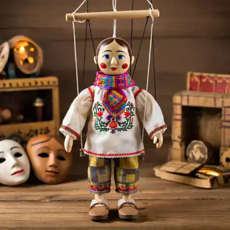 Folk storyteller character marionette with traditional Rajasthani village costume hand-painted details used in educational cultural performances throughout India and international theaters