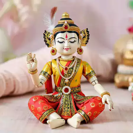 Theater director holding traditional kathputli marionette purchased from WoodenTales workshop for cultural performance production in Rajasthan India